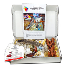 Load image into Gallery viewer, 23 Pc Ultimate Smudging and Cleansing kit with 3 white sage bundles, 2 palo santo sticks, 7 Unique Chakra Stones, 7 Chakra Stone ID Cards, 1 abalone shell with tripod stand, 1 feather and 1 (12) page instruction booklet.