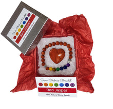 Load image into Gallery viewer, Red jasper heart and chakra bracelet in jewelry box with red tissue paper, information card and lid