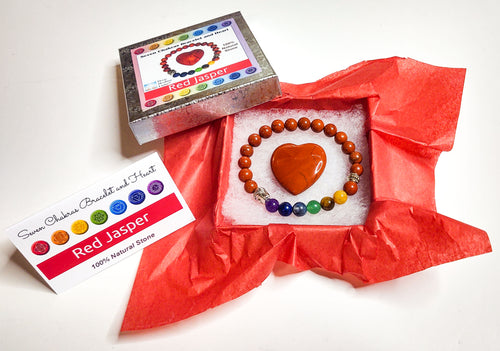 Red jasper heart and chakra bracelet in jewelry box with red tissue paper, information card and lid