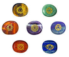 Load image into Gallery viewer, Engraved chakra symbol stones: Red jasper, carnelian, tigers eye, green aventurine, blue aventurine, lapis lazuli, and milky amethyst.
