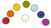 Load image into Gallery viewer, An overhead view of a box of scented chakra healing candles. Shows eight candles, colored, red, orange, yellow, green, light blue, indigo, violet and white.