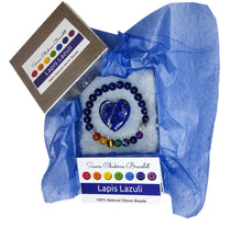 Load image into Gallery viewer, Lapis Lazuli  heart and chakra bracelet in jewelry box with dark blue tissue paper, information card and lid