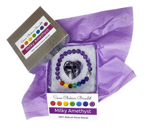 Milky amethyst heart and chakra bracelet in jewelry box with violet tissue paper, information card and lid