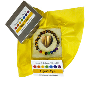 Tiger's eye heart and chakra bracelet in jewelry box with yellow tissue paper, information card and lid